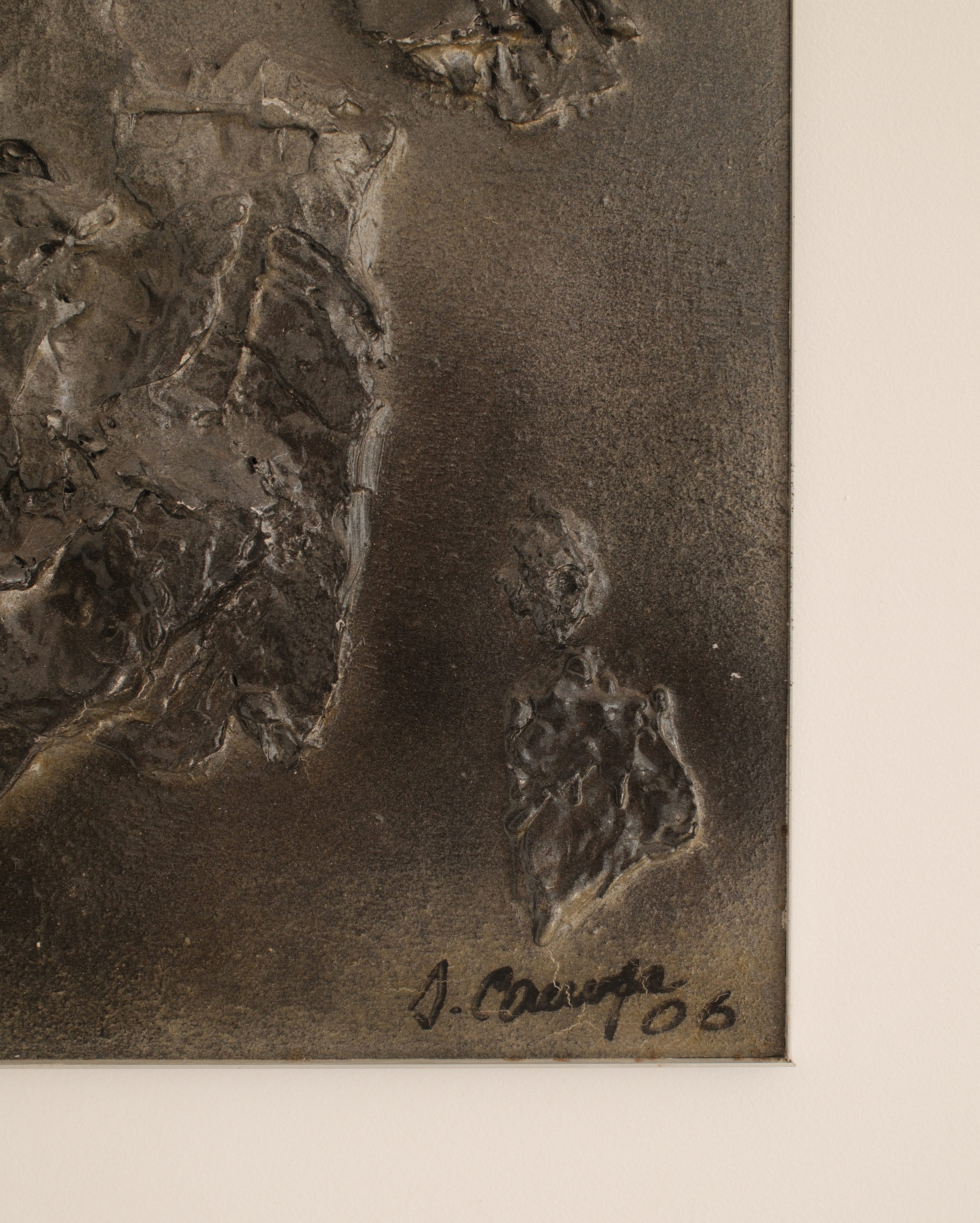 Jean Campa bas-relief — close-up showing signature and textured resin surface
