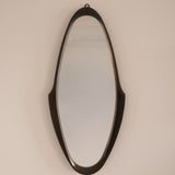 Mid-Century wall mirror — full view showing elongated sculptural silhouette