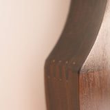Mid-Century wall mirror — close-up of shaped teak edge and grain