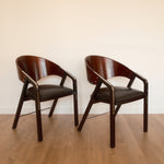 Jaume Tresserra Spinnaker armchairs — dark walnut and black faux leather, Spain, c. 1990s