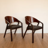 Jaume Tresserra Spinnaker armchairs — dark walnut and black faux leather, Spain, c. 1990s
