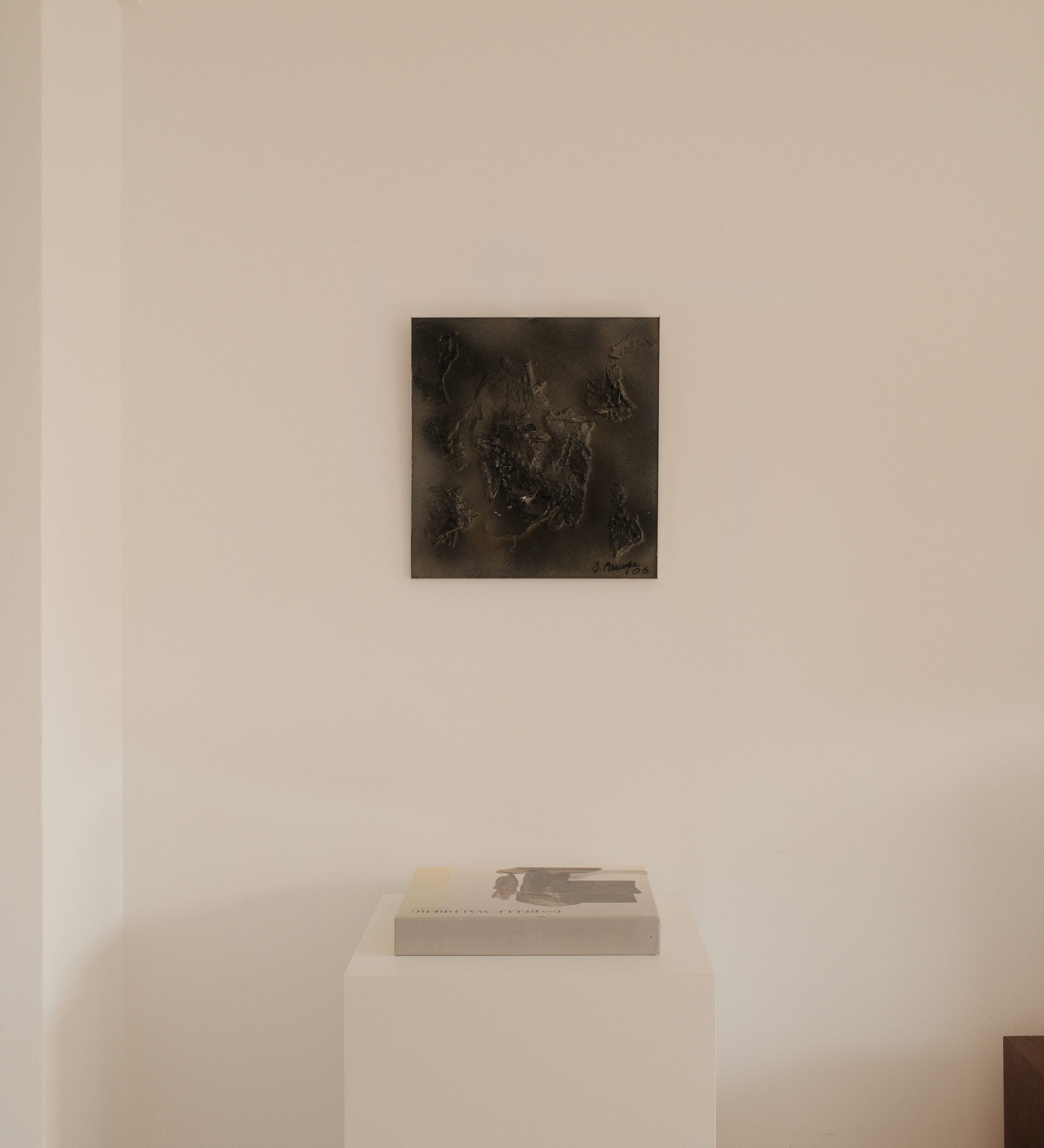 Jean Campa bas-relief — artwork displayed in a minimalist interior