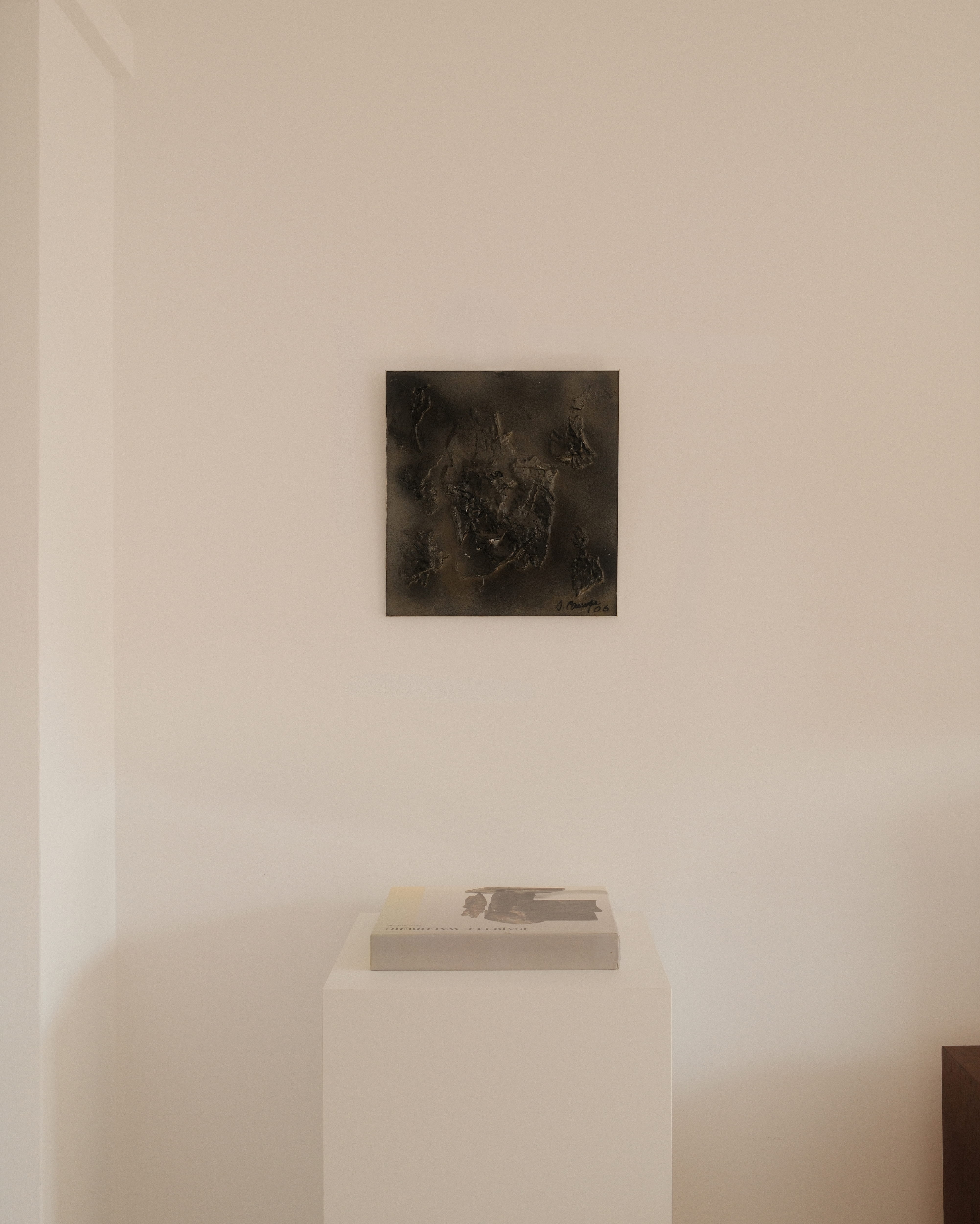 Jean Campa bas-relief — artwork displayed in a minimalist interior