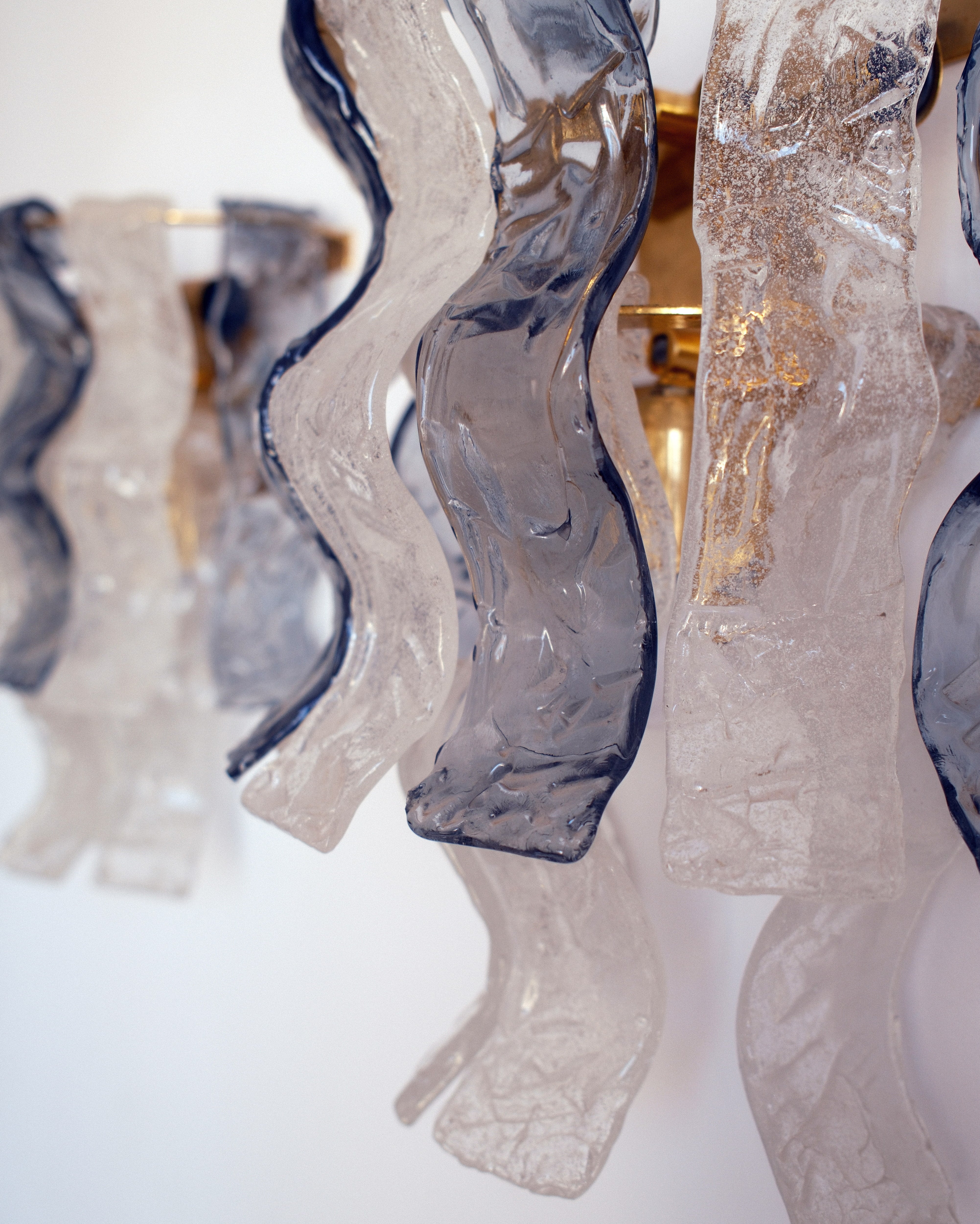 Murano glass wall lights — close-up of bark-textured smoked and clear Murano glass