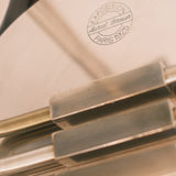 Art Deco table lamps — close-up of stamped manufacturer marking