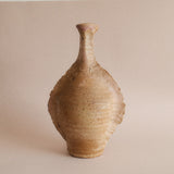 A sculptural vase in patinated stoneware with delicate pink reflections, made in Puisaye